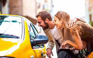 passengers near a taxi